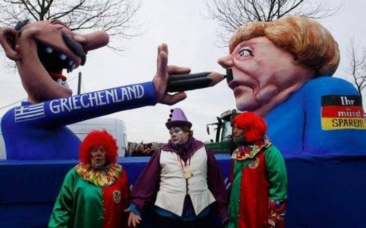 Ο Ελληνας που βάζει μουστάκι στη Μέρκελ στο καρναβάλι του Ντίσελντορφ